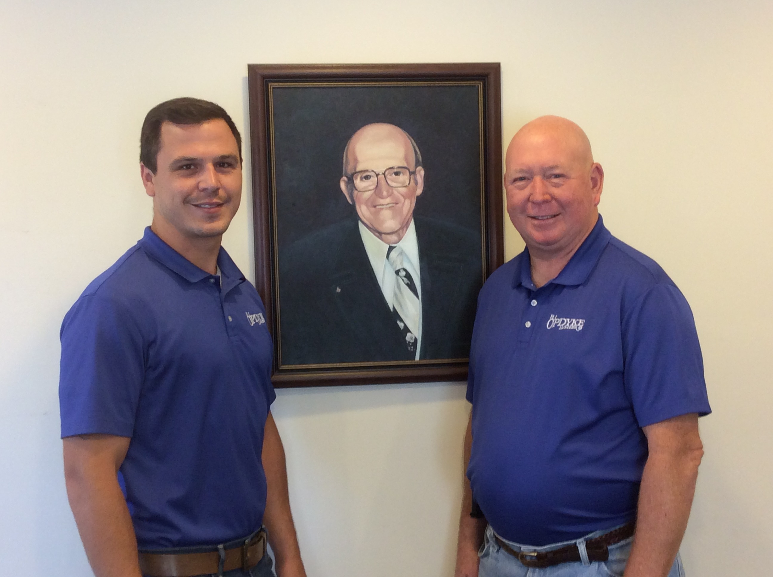 Current owner Jack Opdyke, his son and a portrait of the founder of H.J. Opdyke Lumber Company.